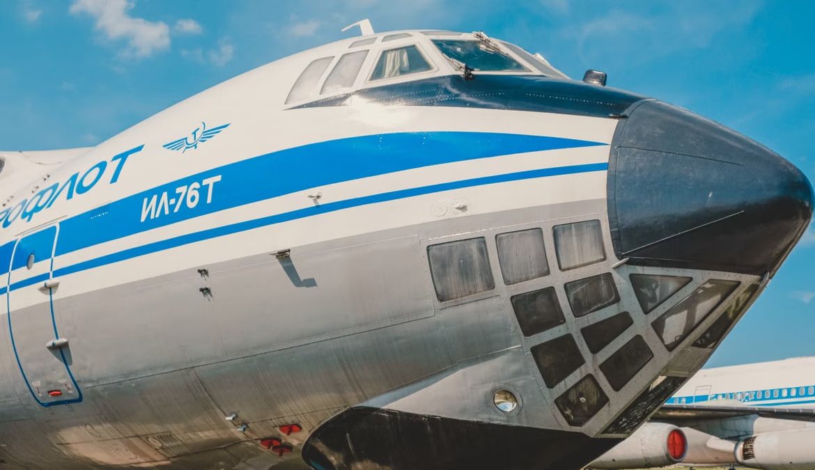 Close-up of IL-76T cargo aircraft displaying iconic Aeroflot branding at a sunny airfield.