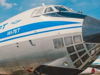 Close-up of IL-76T cargo aircraft displaying iconic Aeroflot branding at a sunny airfield.